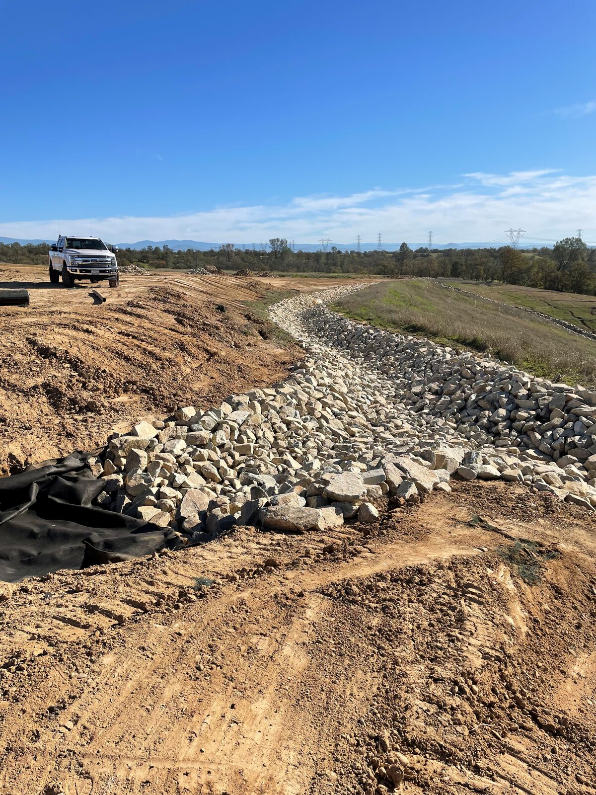 Rock-lined erosion control channel